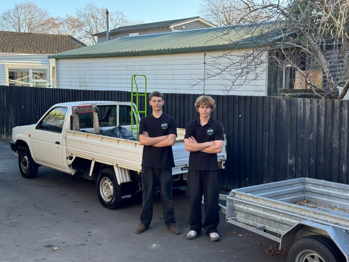 Samuel and Charlie with the James Junk Removal truck and trailer